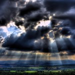 sun through clouds photo