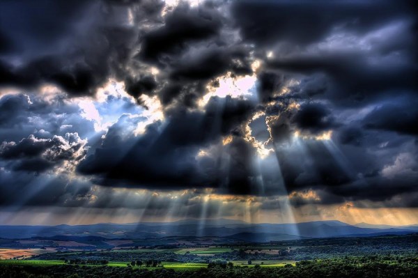sun through clouds photo