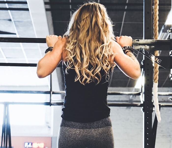 woman at gym pullup exercise List Of Habits