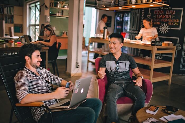 men talking in coffee shop communication styles