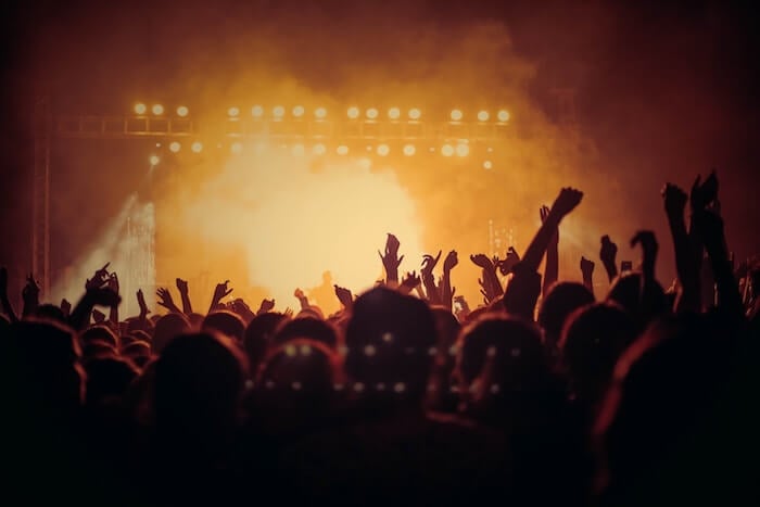 crowd at rock concert stage romantic things to do