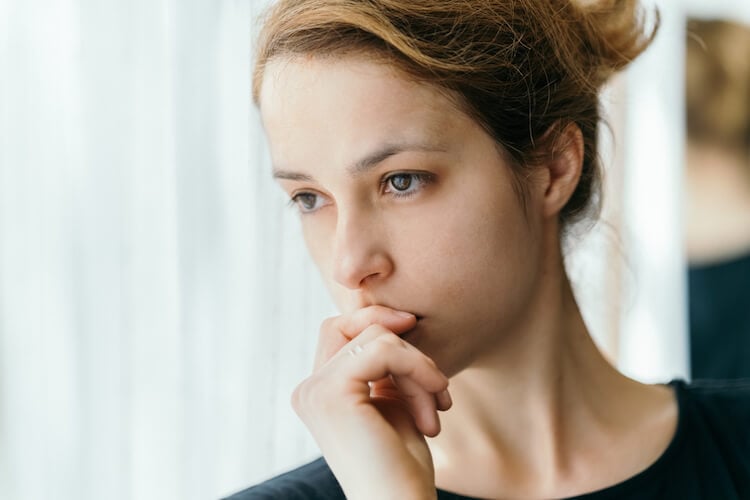 woman standing by window signs your wife is cheating