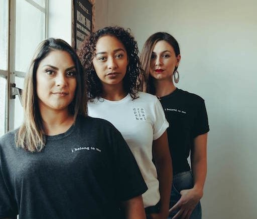 woman standing by window strong women