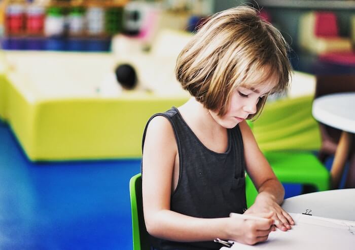 young girl writing in school classroom growth mindset quotes