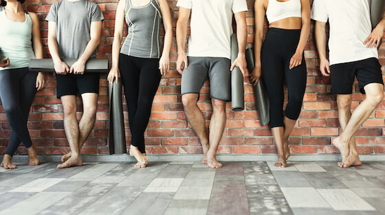 people holding yoga mats while leaning on wall fun things to do at home