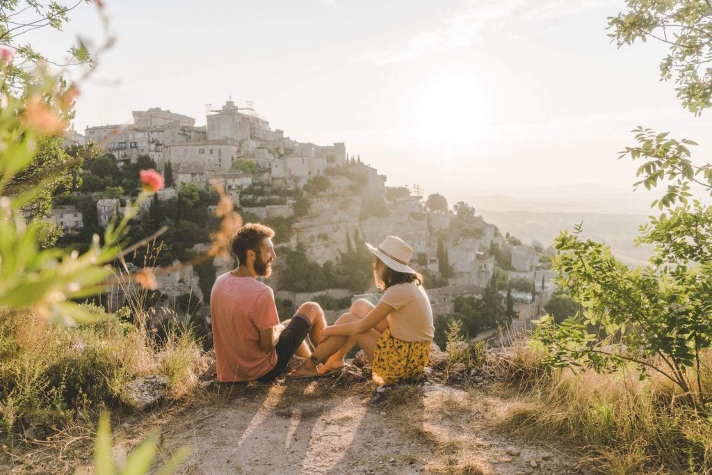 couple sitting on mountain top talking communication exercises for couples