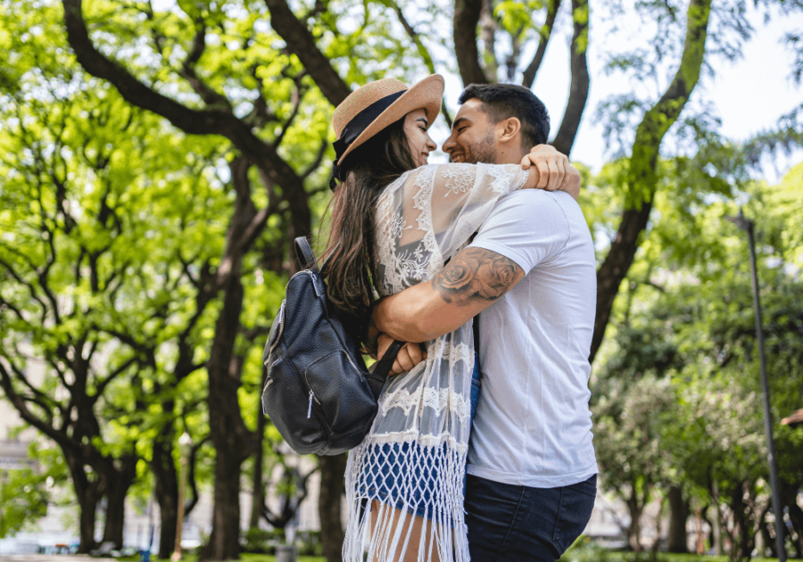 couple hugging in park signs your ex is testing you