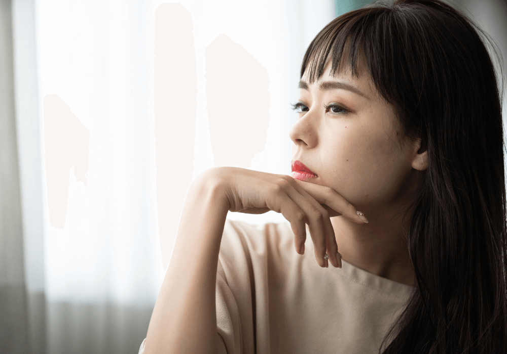 contemplative asian woman psyching yourself out