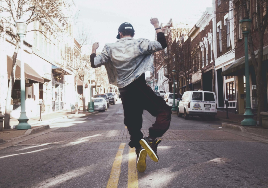 man dancing in the street what is an omega male
