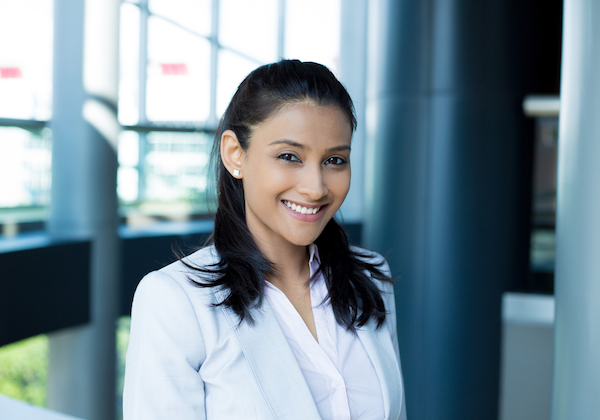 woman smiling in office Smartest Personality Types