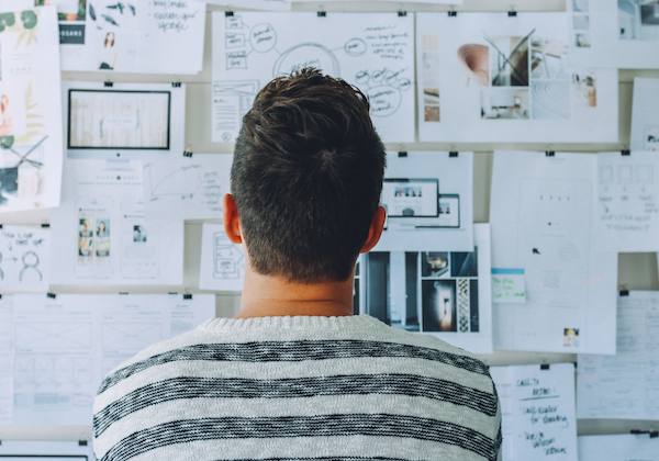 man looking at board Smartest Personality Types