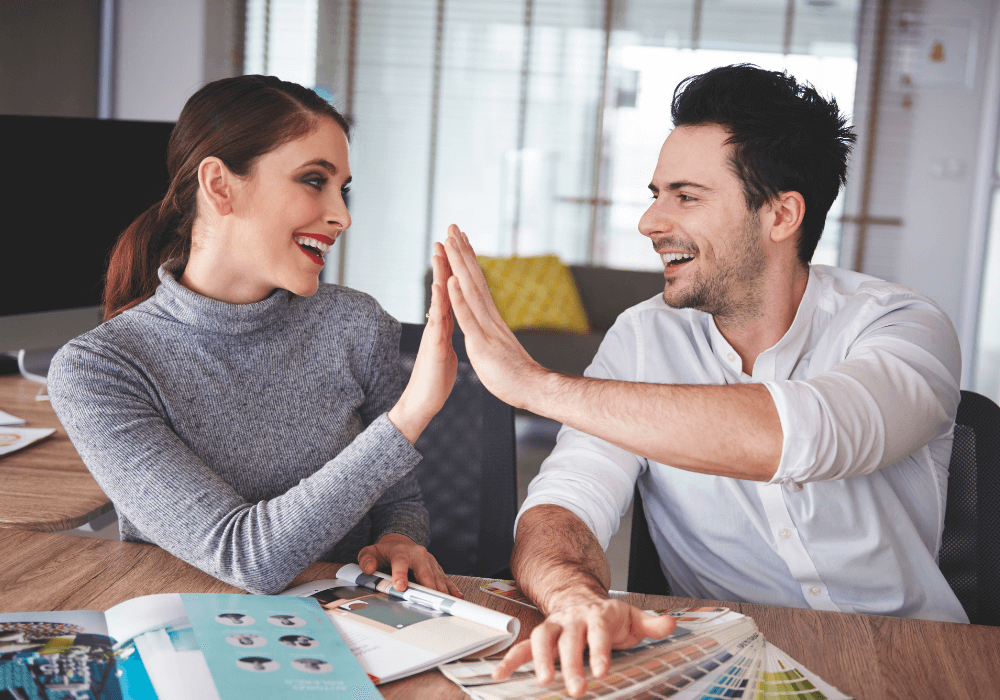 happy couple giving high five stages of a relationship