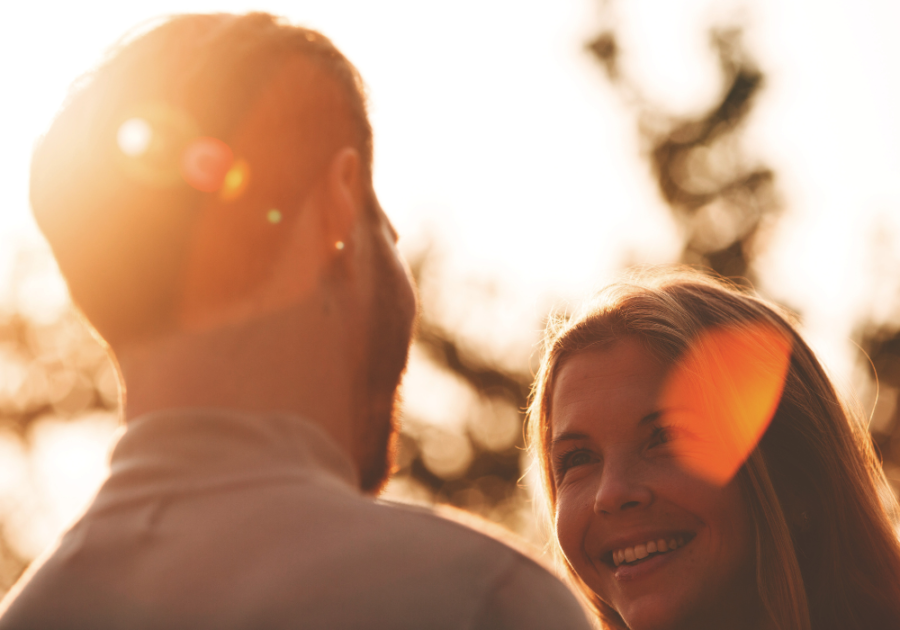 couple sitting on sofa talking questions to ask your boyfriend to test his love