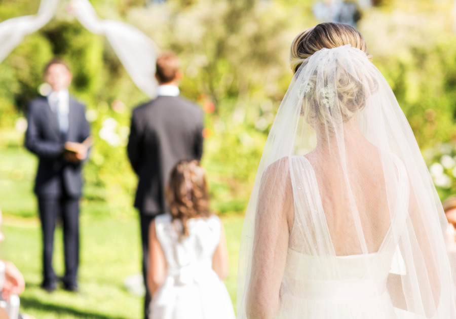 bride walking down aisle outdoor wedding letter to wife on wedding day