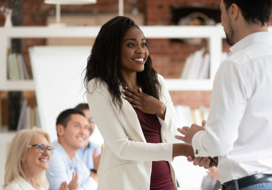 officemates shaking hands signs your boss likes you but is hiding it 