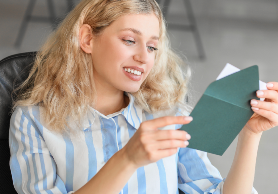 woman reading letter How To Write a Thank You Letter to a Friend 