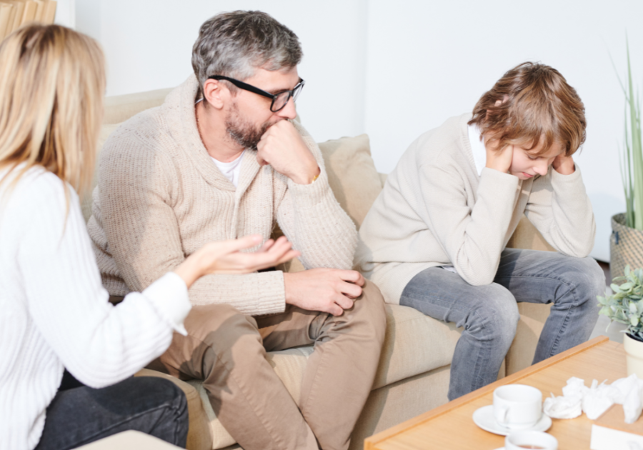 kid covering his ears while parents are talking dysfunctional family roles 