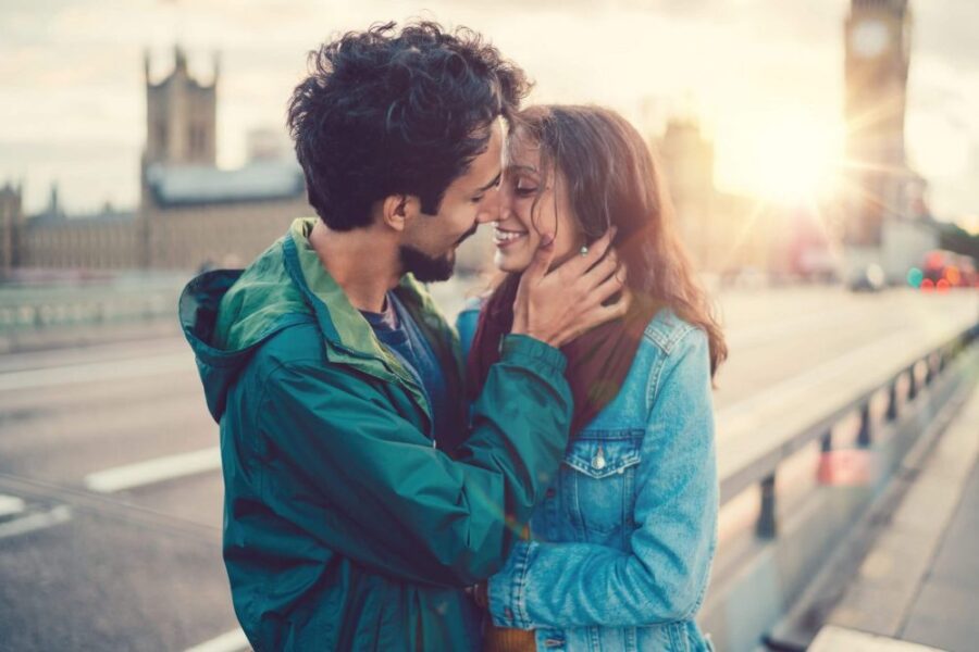 couple embracing outside common ways men express love