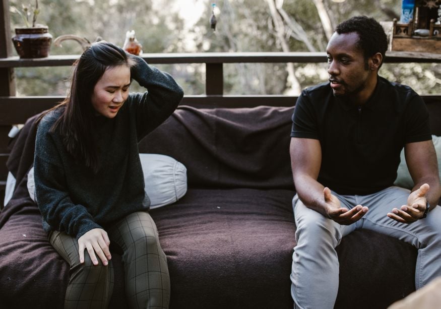 couple talking on sofa woman is upset Narcissistic Projection