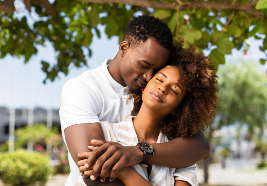 man hugging woman from behind what type of woman is an alpha male attracted to?