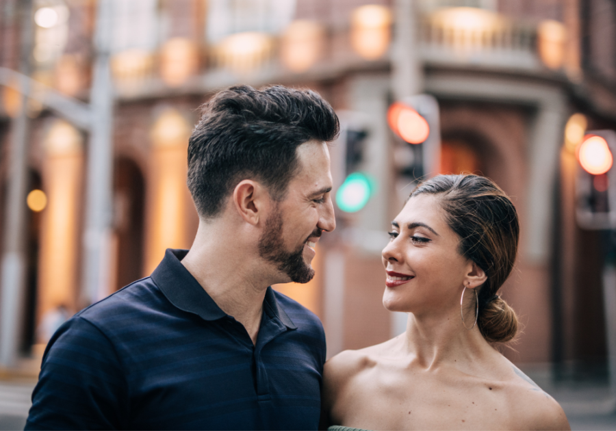 couple smiling at each other what type of woman is an alpha male attracted to?