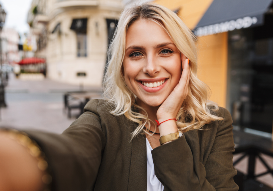 woman taking selfie photo what type of woman is an alpha male attracted to