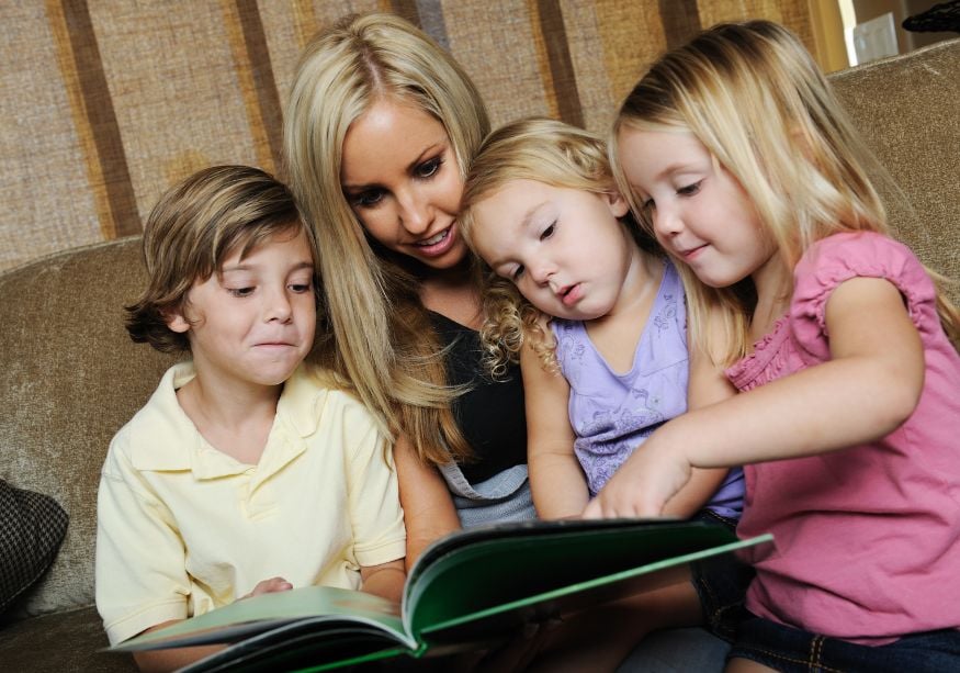 mom sitting with children reading Rules for Living Together When Separated 
