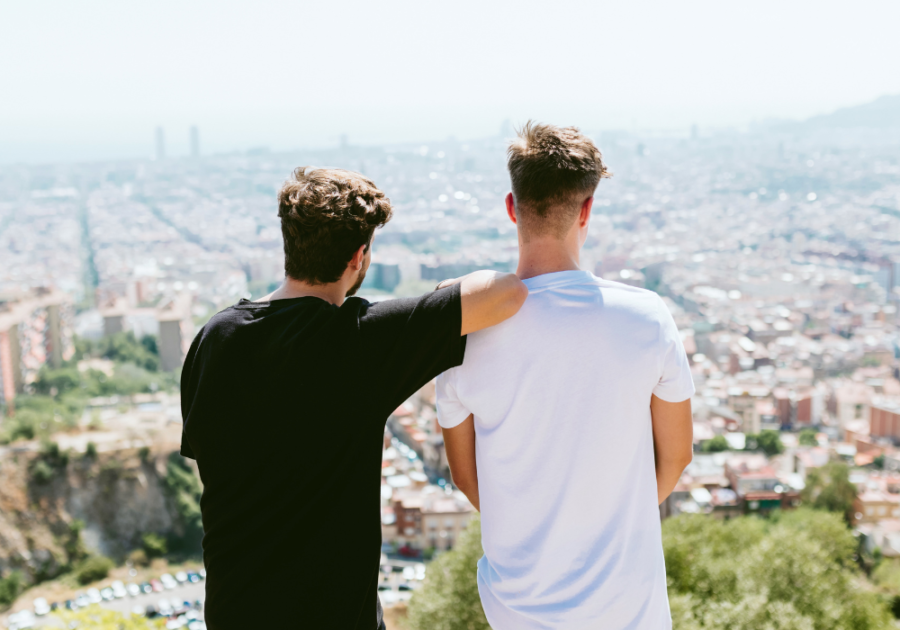 men standing at overlook to city signs of Bisexuality in Males 