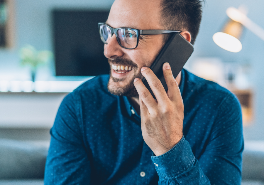 man on phone laughing Funny Responses When Someone Asks, "How Are You?"