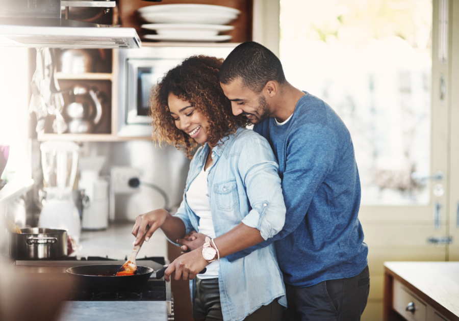 couple cooking together smiling Qualities Of A Good Wife