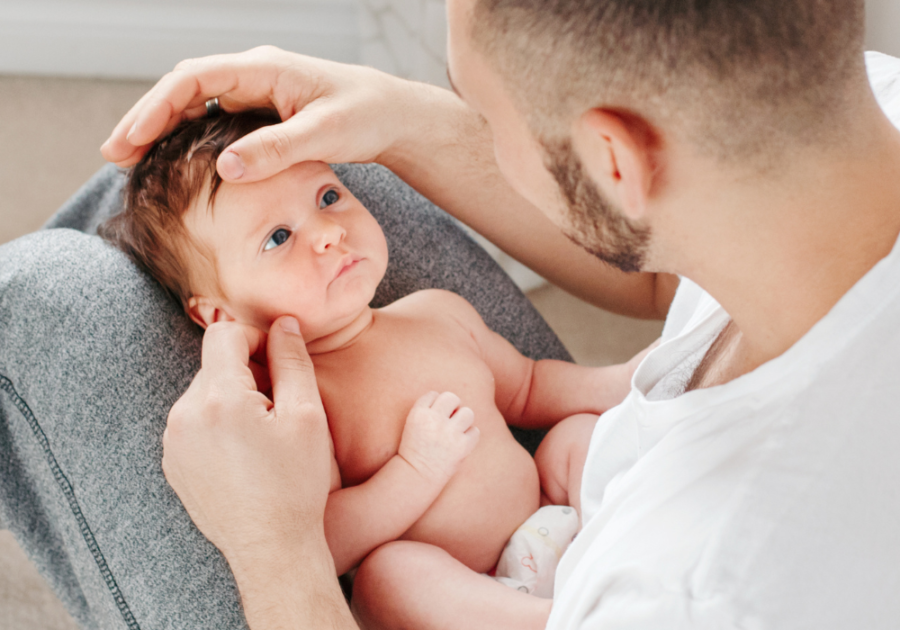 man holding baby feminine vs Masculine Energy