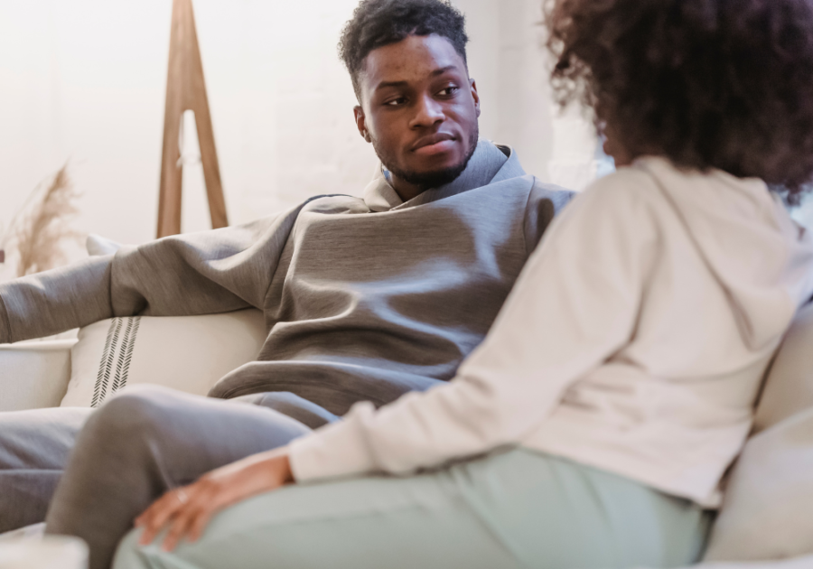 man listening to woman sitting of sofa Expectations in a Relationship