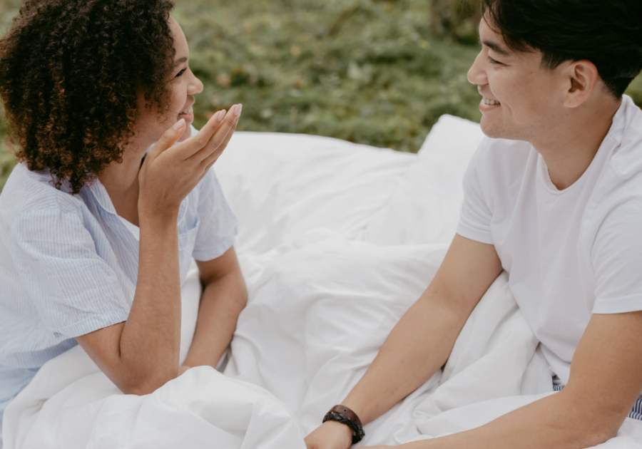 Couple sitting outside talking under blanket 80/20 rules in relationships