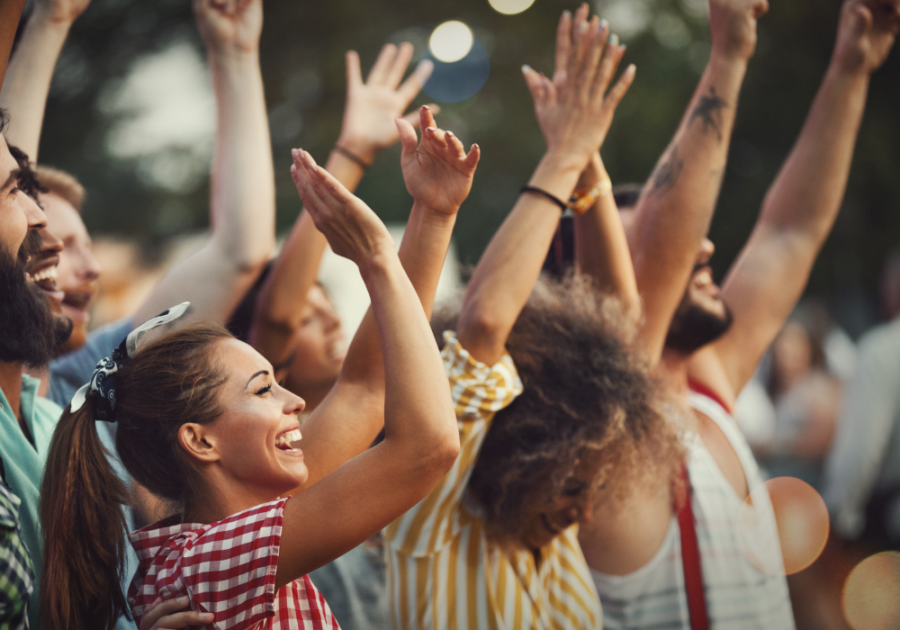 crowd of people laughing clapping what to do on a Saturday night