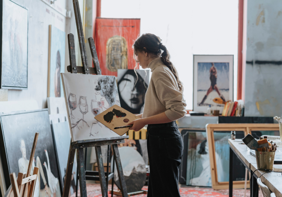 woman painting in studio dark feminine energy