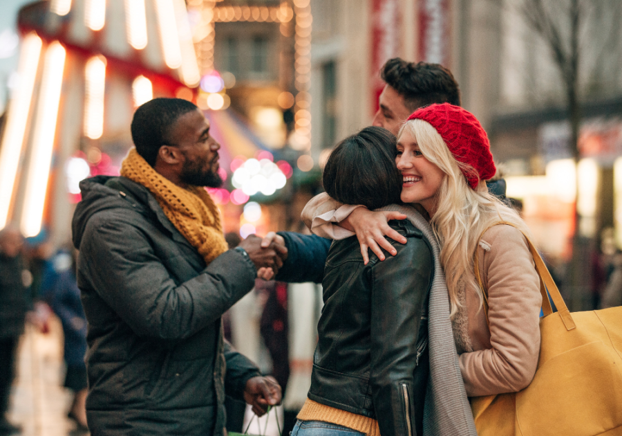 Group of friends hugging and laughing, how to react to what is happening