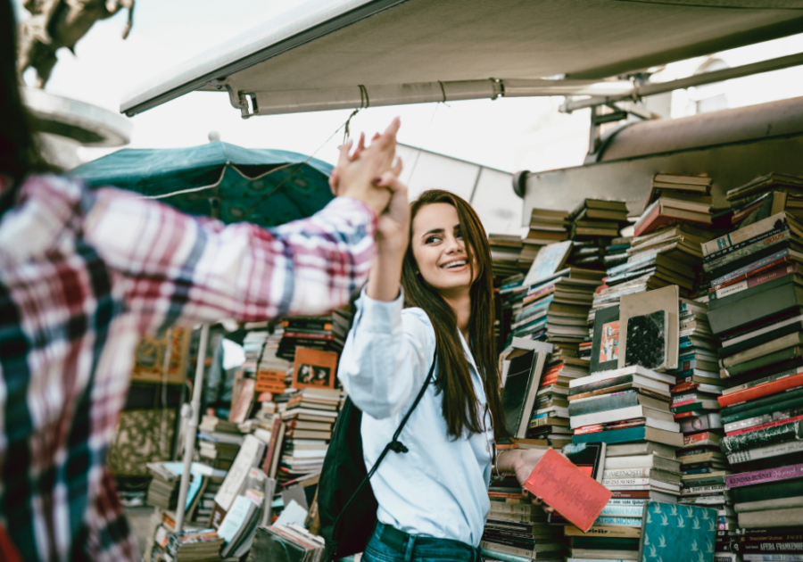 women holding hands at outdoor book fair how to respond to what's up