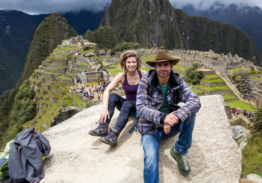 couple hiking on mountain top What an Aquarius Man Needs in a Woman