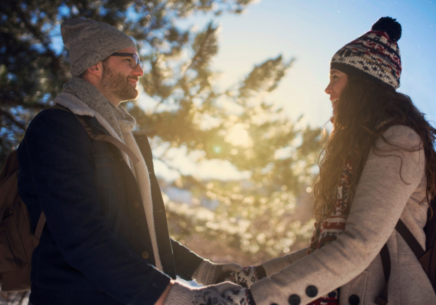 couple facing each other outside in winter Unexplainable Connection with Someone