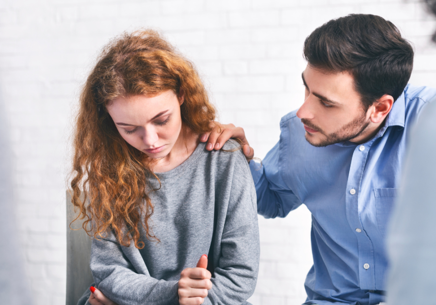 couple sad man touching her shoulder Reassurance in a Relationship