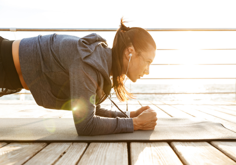 woman working out indoors man sitting at desk thinking traits of a stoic personality