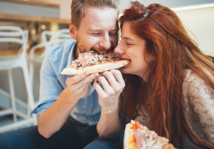 man feeding woman pizza Unconsciously Saying 