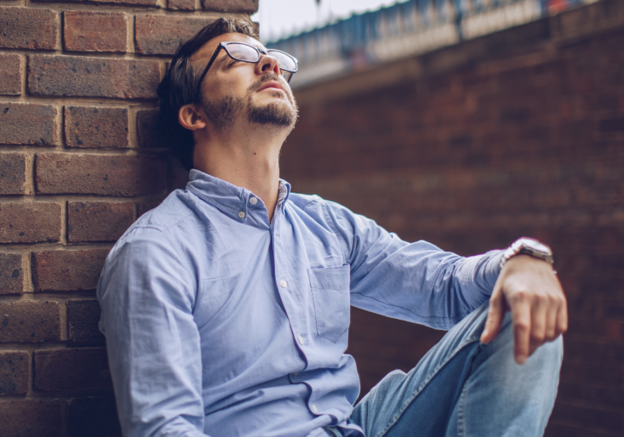 man sitting by wall Signs You Will Never Find Love