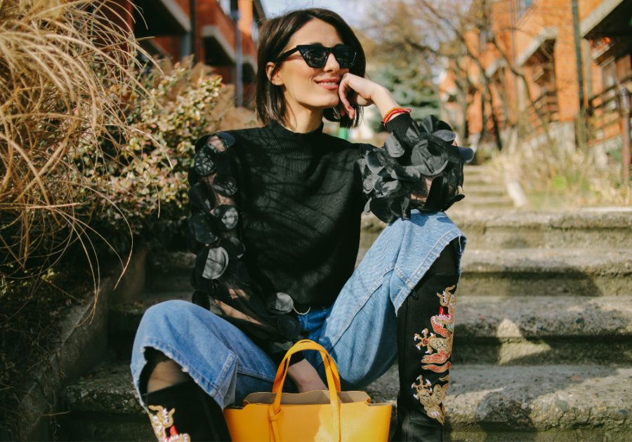 woman sitting outside Prettiest Zodiac Sign