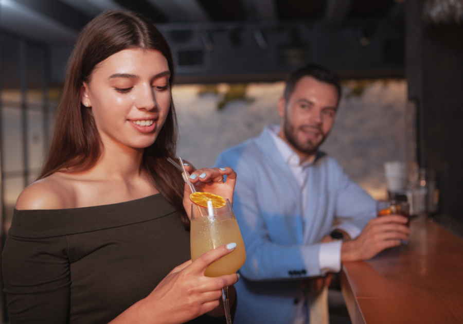 man watching woman at bar how to Seduce a Man