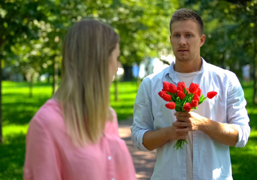 man offers woman flowers How Long Does a Crush Last?