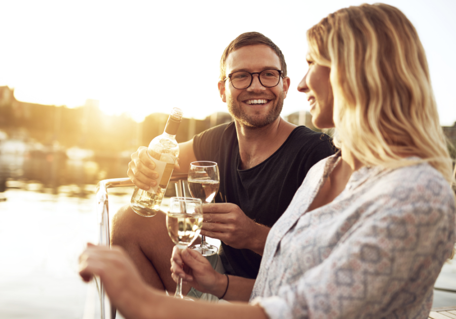 couple drinking wine outdoors how to tell if a guy is interested in your or just being friendly