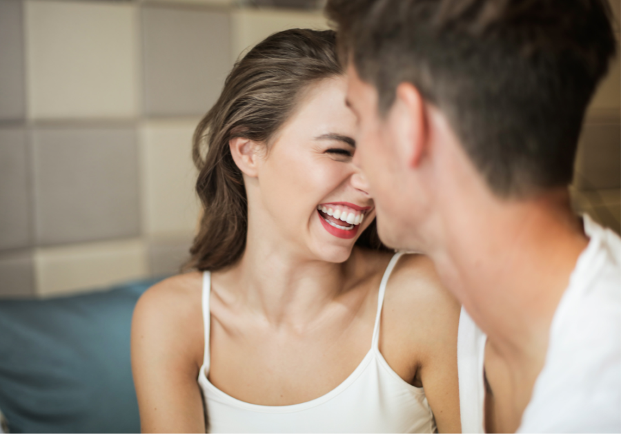 couple laughing science of what turns women on