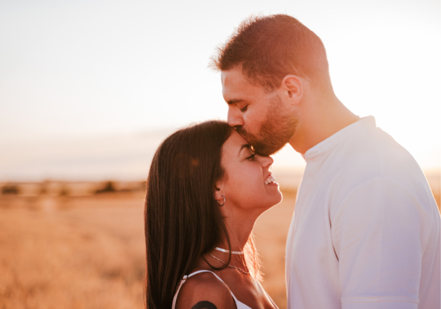 man kissing woman on forehead Signs a Taurus Man is Sexually Attracted to You