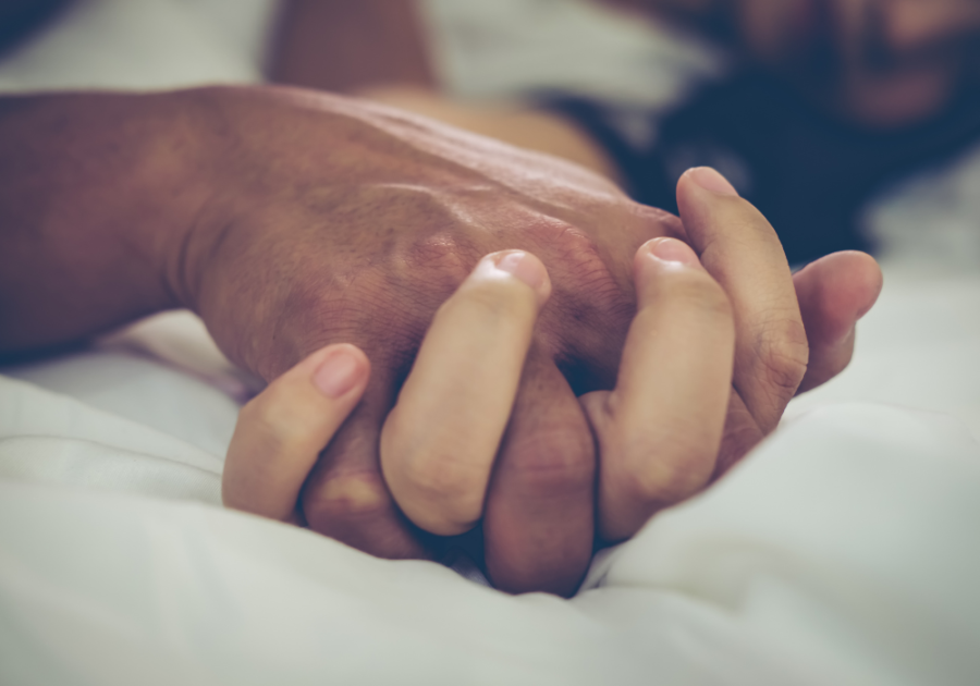 man and woman holding hands what makes a man sexually attractive